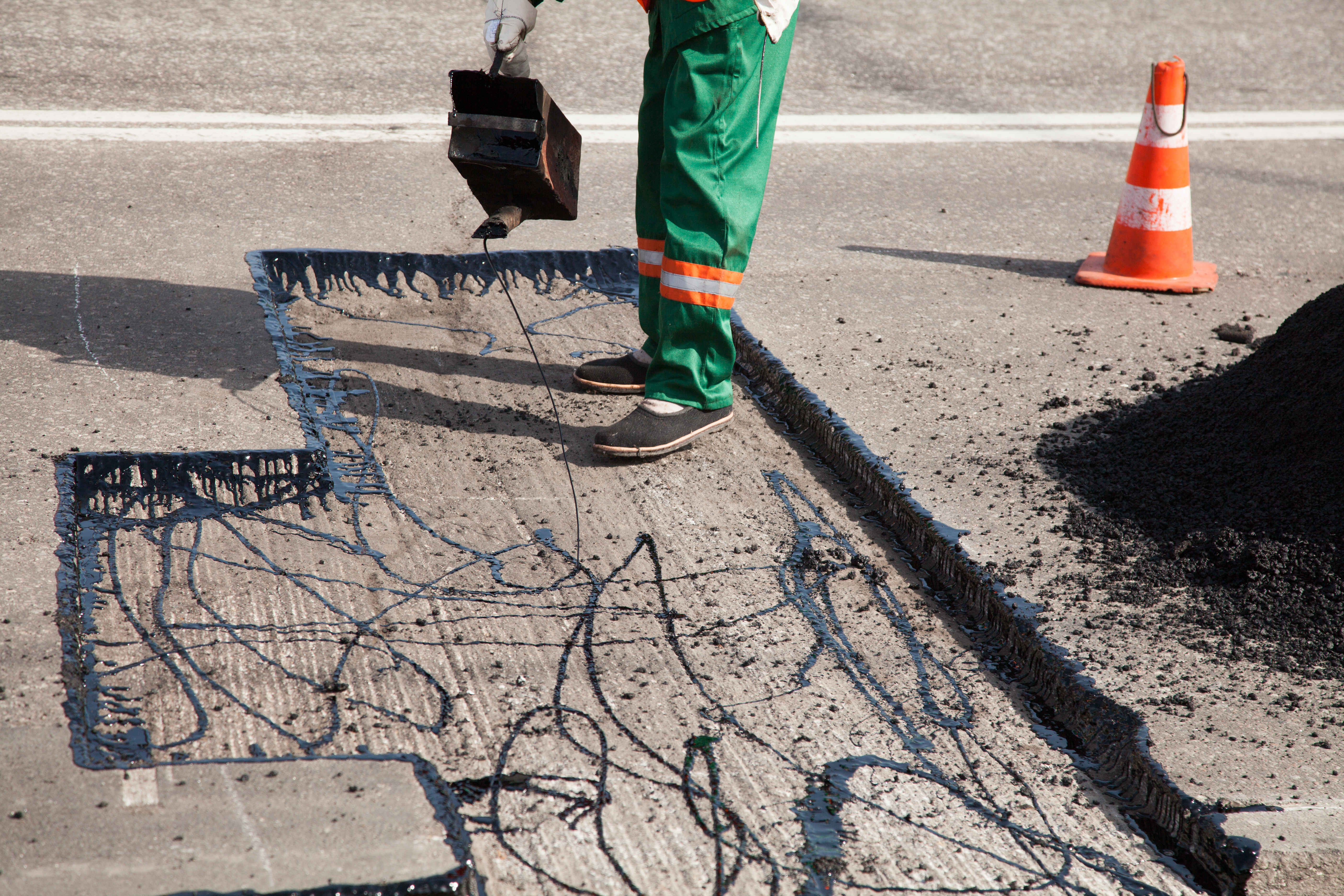 asphalt pouring tar road repair
